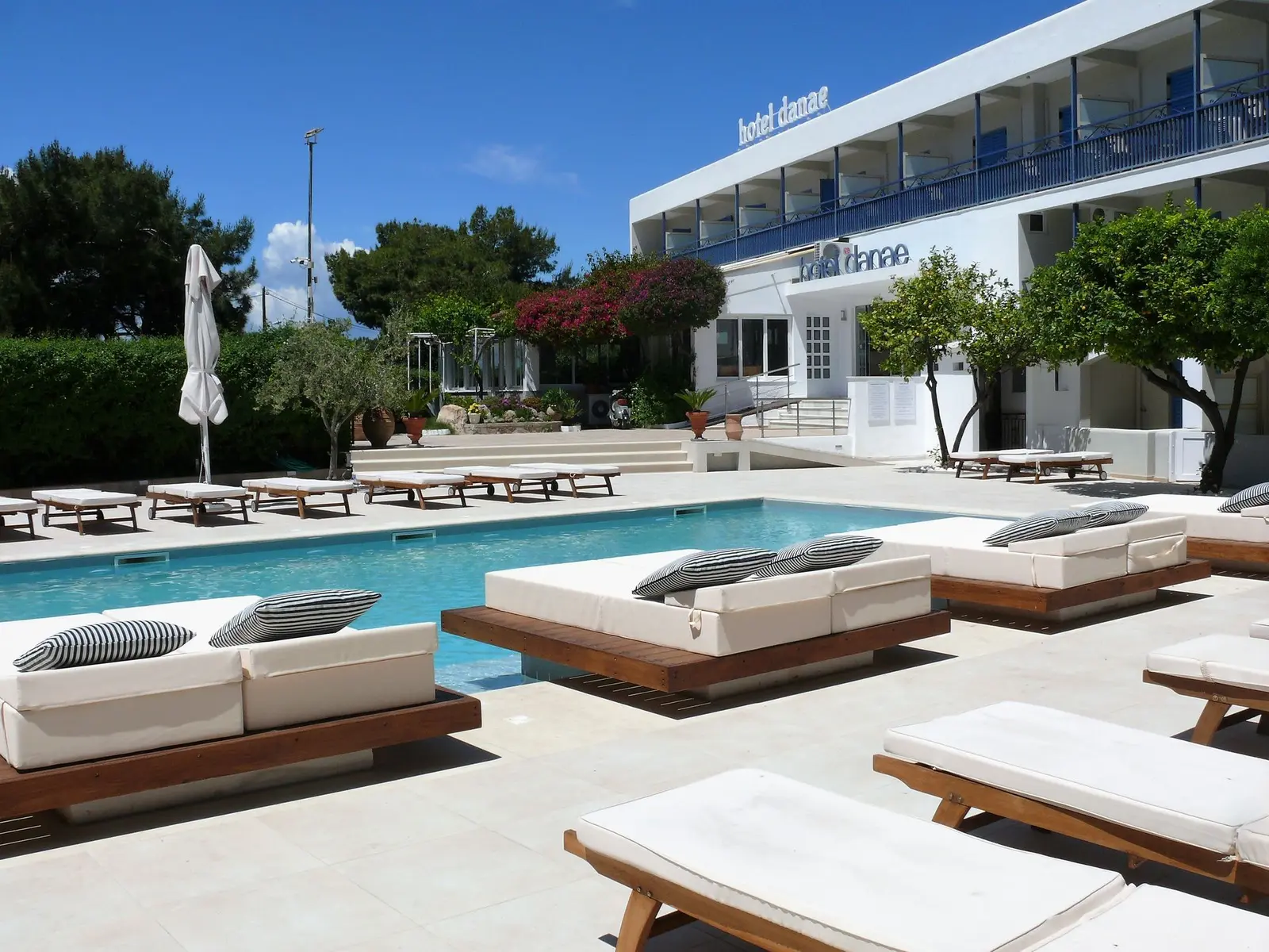 Outdoor lounge and pool area at Danae Hotel in Aegina